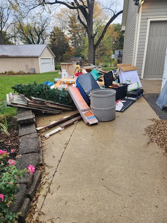 Dumpster being loaded with debris for 3 Yard Dumpster Rental in James Island